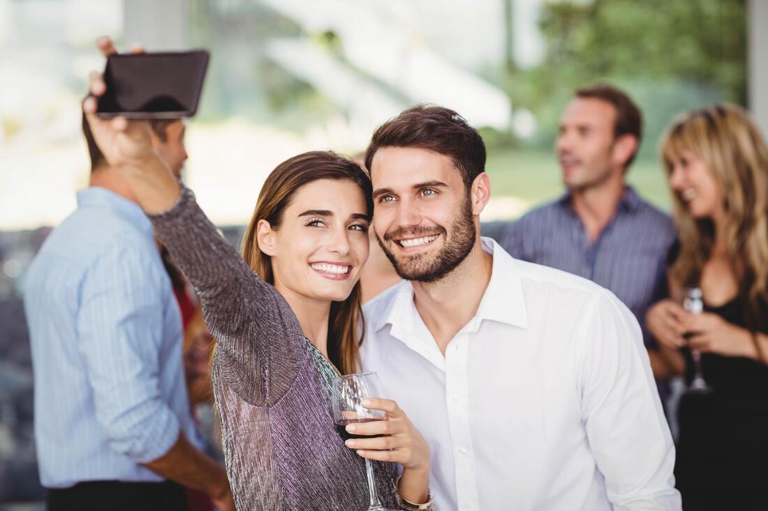 two freinds takin selfie on a birthday party